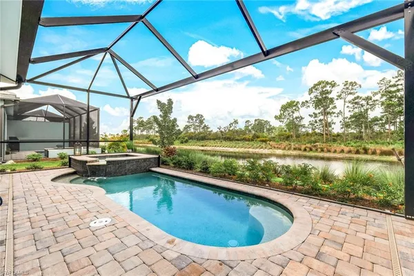 a view of swimming pool with a patio