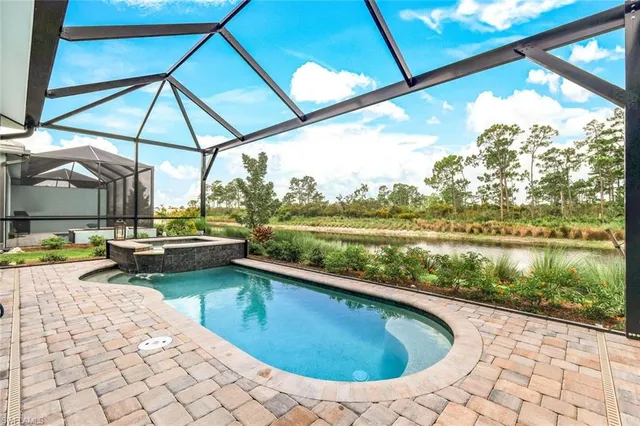 a view of swimming pool with a patio