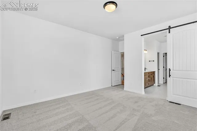 a spacious bathroom with a tub sink and mirror