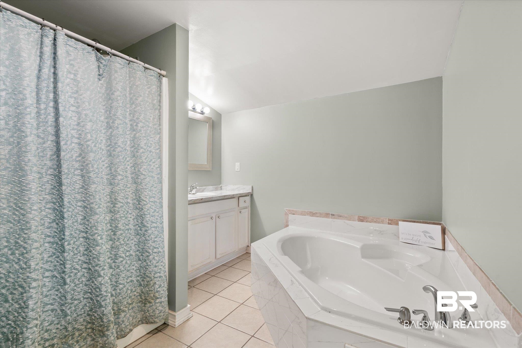 529 Cleveland Road Saraland, AL 36571 - Photo 14 of 31 Full bathroom with tile patterned floors, vanity, and a garden tub