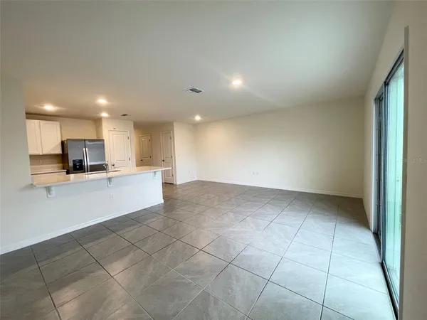 a view of kitchen electric appliances and cabinets