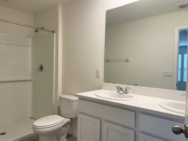 a bathroom with a sink toilet and vanity