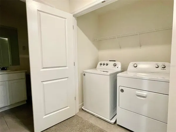a utility room with dryer and washer
