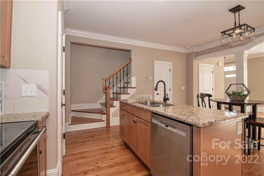 333 Spring Street Davidson, NC 28036 - Photo 16 of 44 a kitchen with sink stove and cabinets