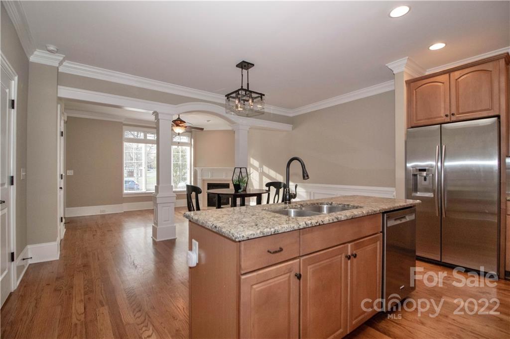333 Spring Street Davidson, NC 28036 - Photo 17 of 44 a kitchen with stainless steel appliances granite countertop a sink refrigerator and cabinets