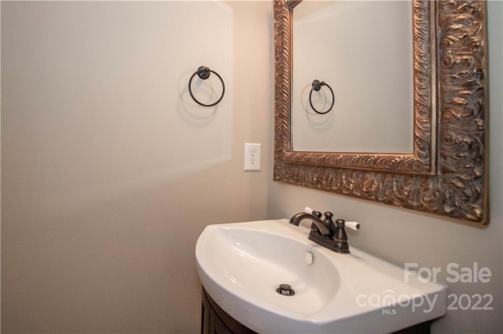 333 Spring Street Davidson, NC 28036 - Photo 19 of 44 a bathroom with a sink and a mirror