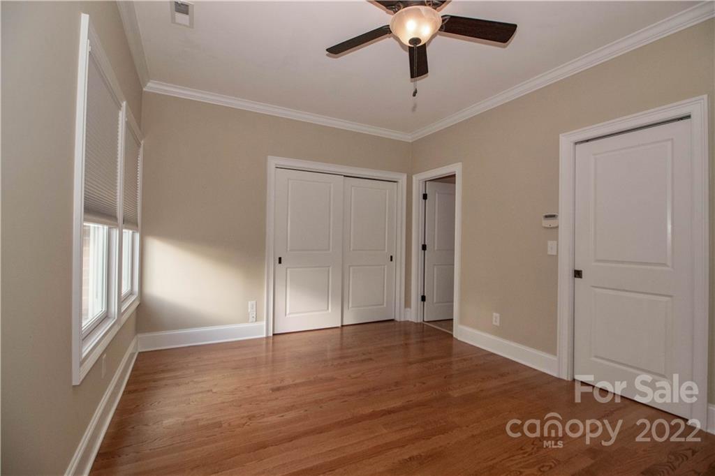 333 Spring Street Davidson, NC 28036 - Photo 22 of 44 wooden floor in an empty room with a window