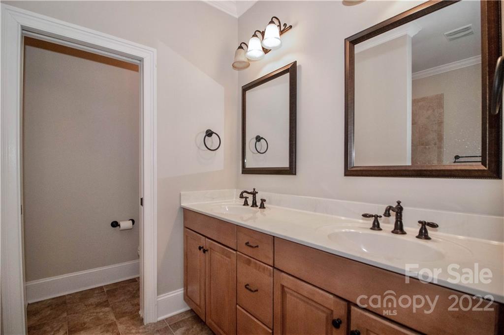 333 Spring Street Davidson, NC 28036 - Photo 25 of 44 a bathroom with a sink and a mirror