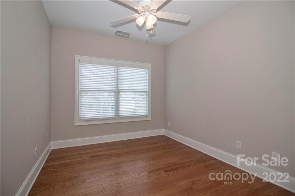 333 Spring Street Davidson, NC 28036 - Photo 27 of 44 an empty room with wooden floor closet and windows