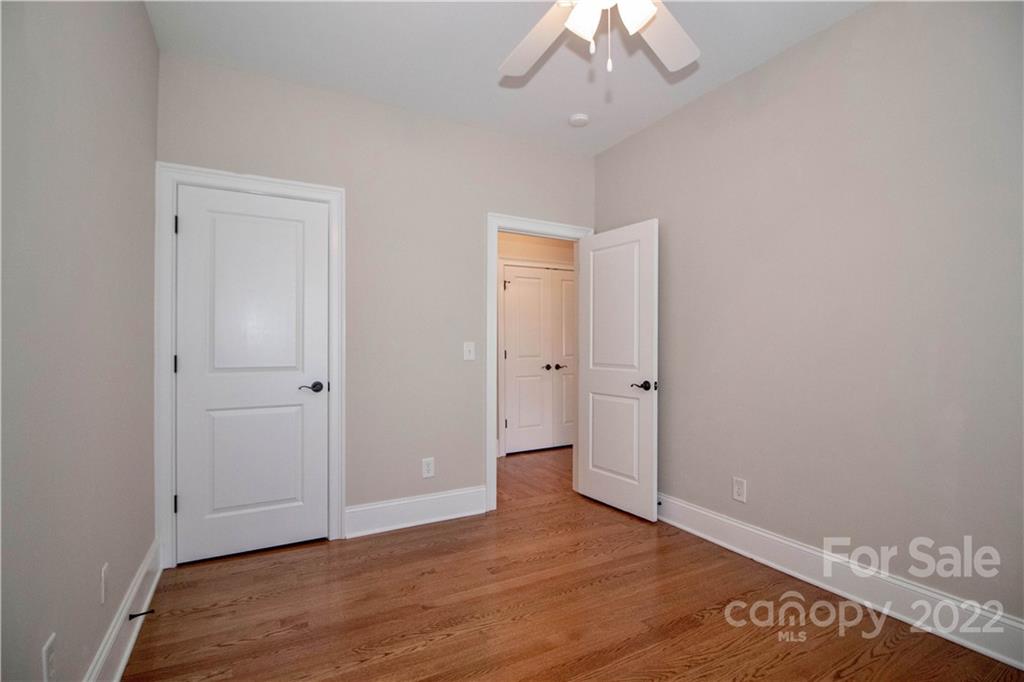 333 Spring Street Davidson, NC 28036 - Photo 28 of 44 a view of an empty room with wooden floor