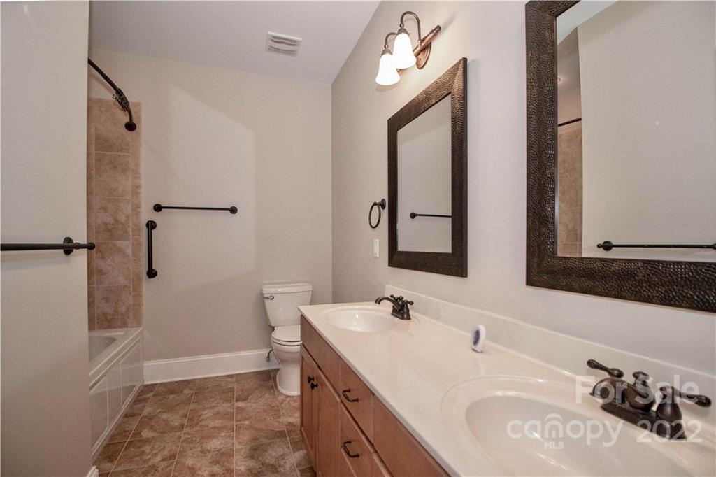 333 Spring Street Davidson, NC 28036 - Photo 29 of 44 a bathroom with a sink and a mirror