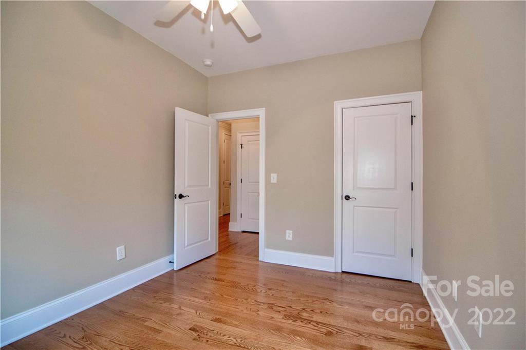 333 Spring Street Davidson, NC 28036 - Photo 31 of 44 a view of an empty room with wooden floor