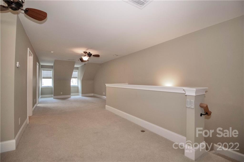 333 Spring Street Davidson, NC 28036 - Photo 32 of 44 a view of a chandelier fan and entryway