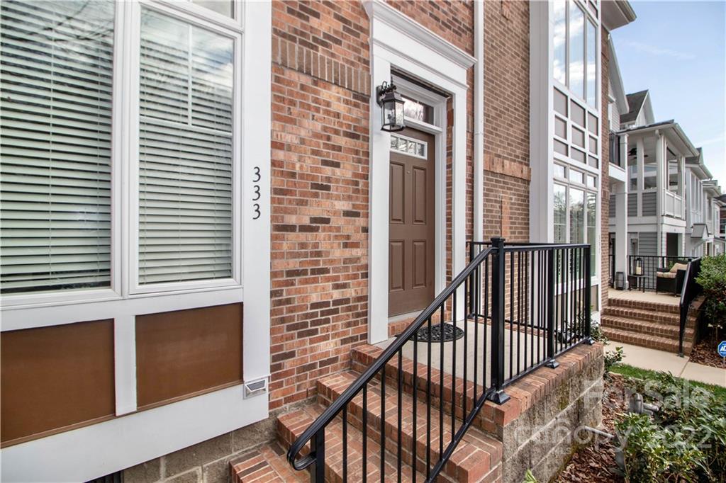 333 Spring Street Davidson, NC 28036 - Photo 4 of 44 a view of a brick building from a balcony