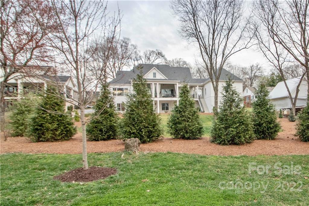 333 Spring Street Davidson, NC 28036 - Photo 41 of 44 a front view of a house with a yard and an trees