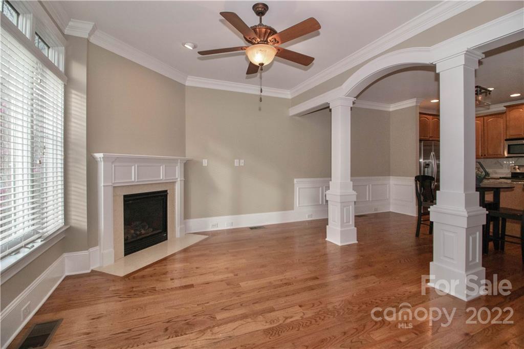 333 Spring Street Davidson, NC 28036 - Photo 6 of 44 a view of an empty room with window and fireplace