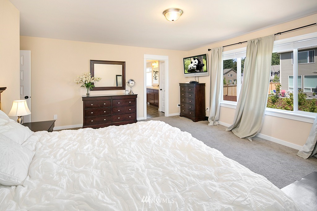 3815 222nd Place Southeast Bothell, WA 98021 - Photo 11 of 20 a bedroom with a bed and a dresser