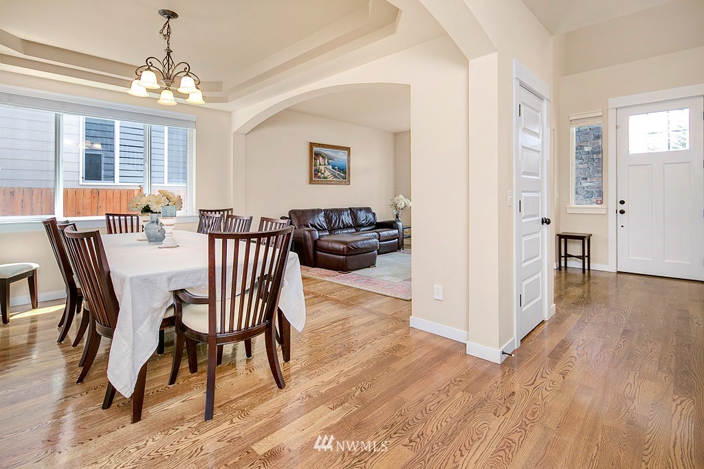 3815 222nd Place Southeast Bothell, WA 98021 - Photo 3 of 20 a view of a dining room with furniture window and wooden floor
