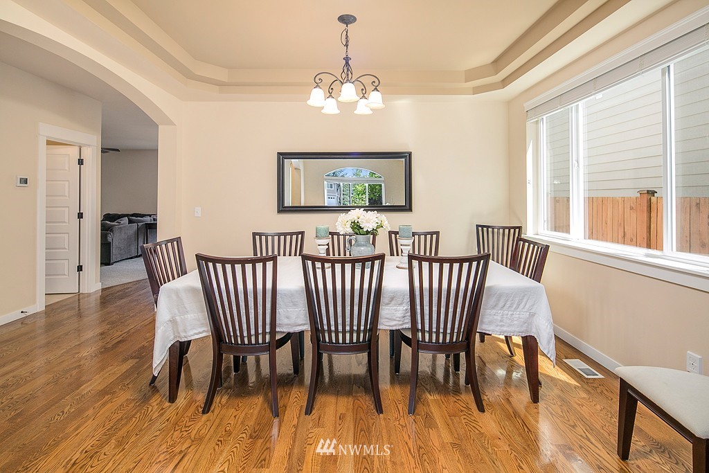 3815 222nd Place Southeast Bothell, WA 98021 - Photo 5 of 20 a view of a dining room with furniture window and wooden floor