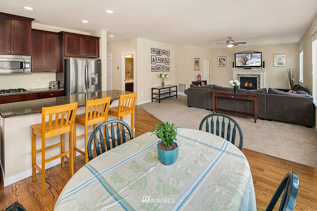 3815 222nd Place Southeast Bothell, WA 98021 - Photo 7 of 20 a living room with furniture kitchen view and a refrigerator
