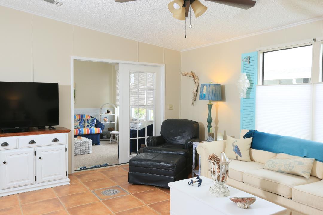 1021 Sebastian Road Barefoot Bay, FL 32976 - Photo 7 of 32 7 1021 Sebastian Rd - Living Room Porchj