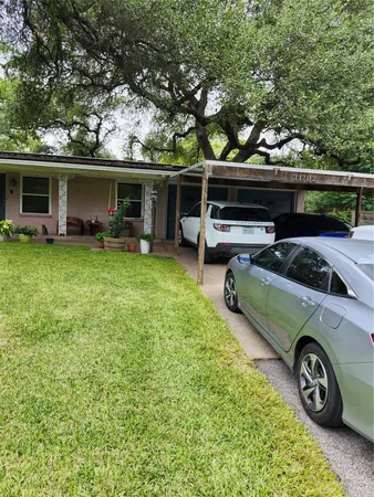 a view of a car parked in front of a house
