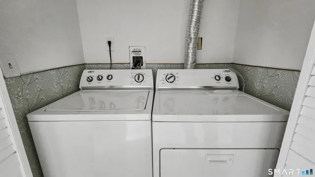 a bathroom with a shower and a toilet