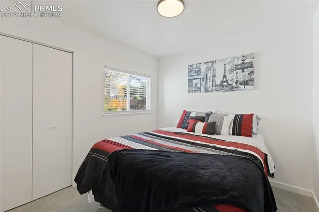 a bedroom with bed and a window