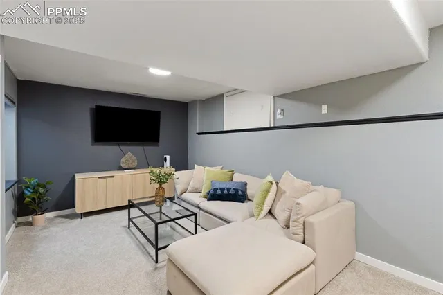 a view of a livingroom with furniture and a potted plant
