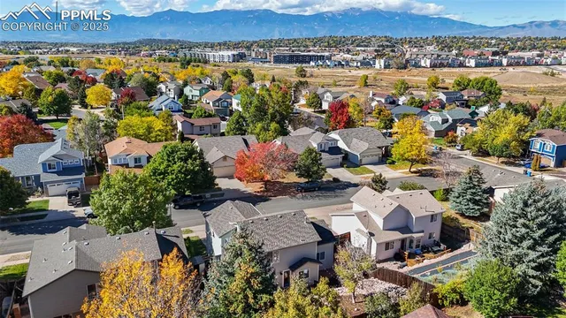 an aerial view of residential houses with outdoor space