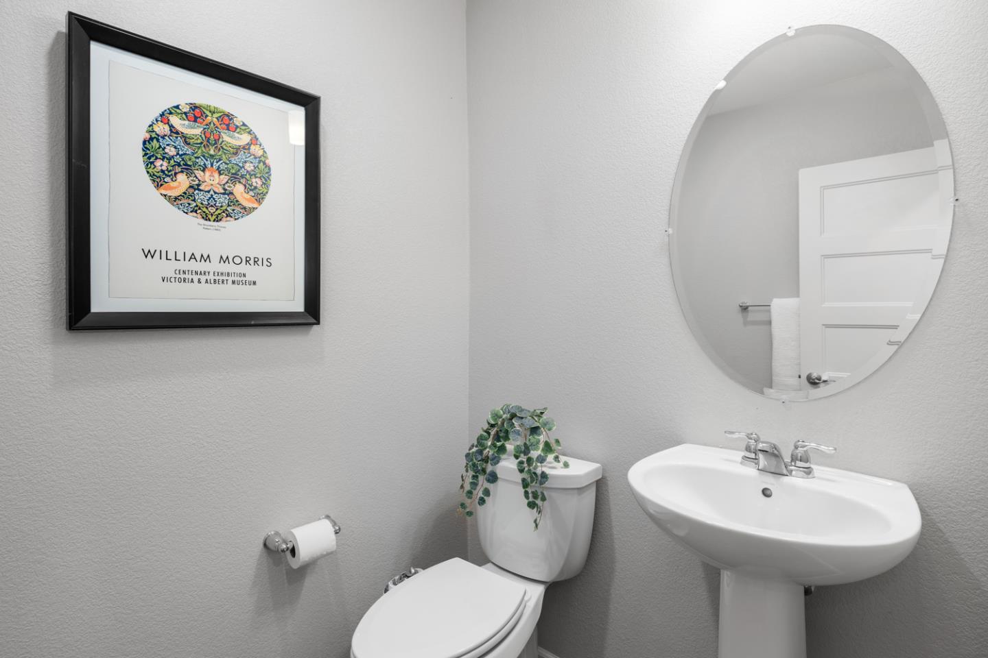 2208 Rosenblatt Street Hayward, CA 94544 - Photo 18 of 32 a bathroom with a toilet sink and mirror