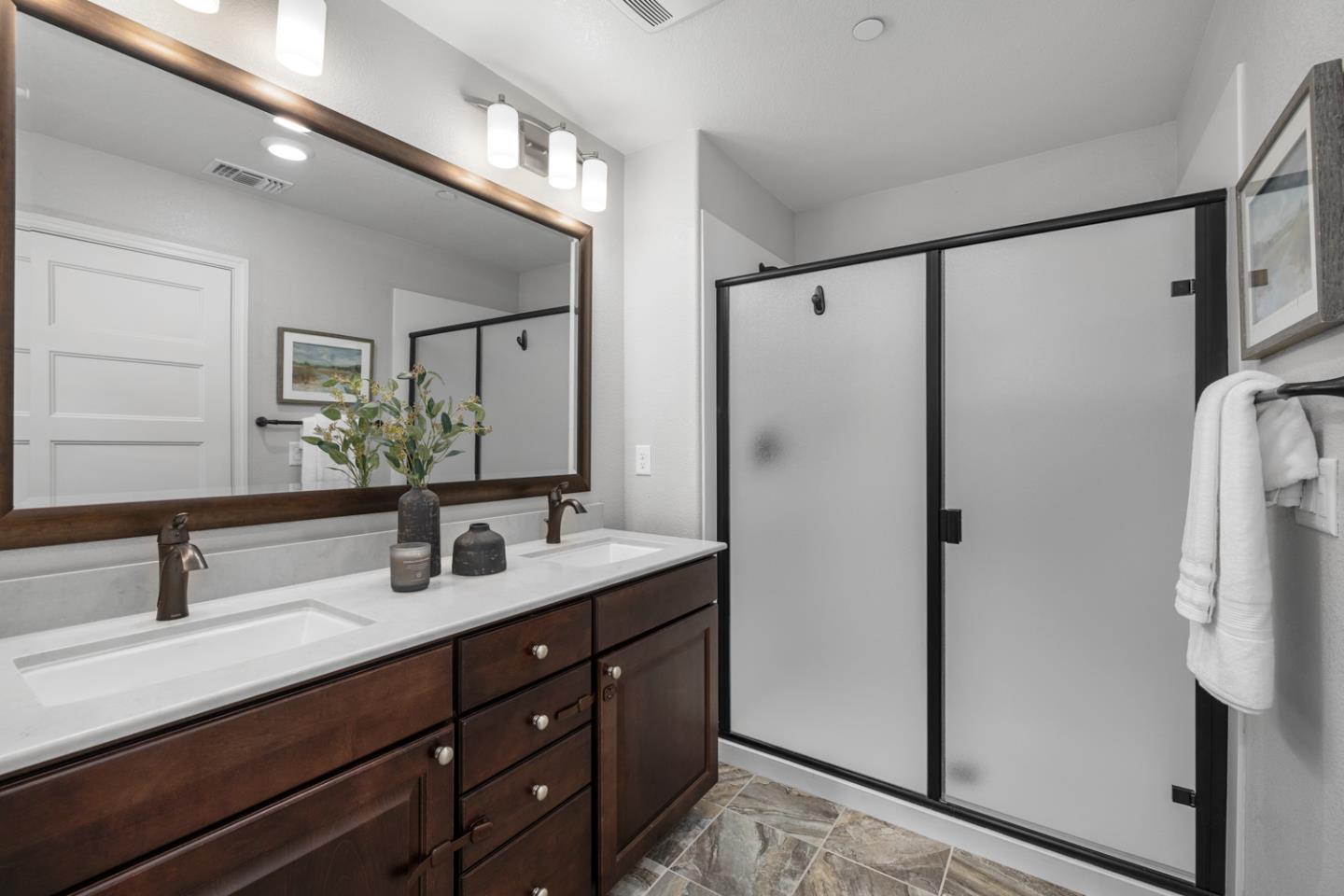 2208 Rosenblatt Street Hayward, CA 94544 - Photo 22 of 32 a bathroom with a double vanity sink and mirror