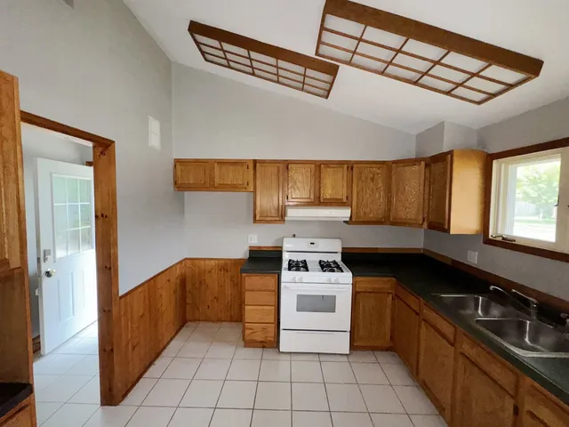 a kitchen with a sink and a window