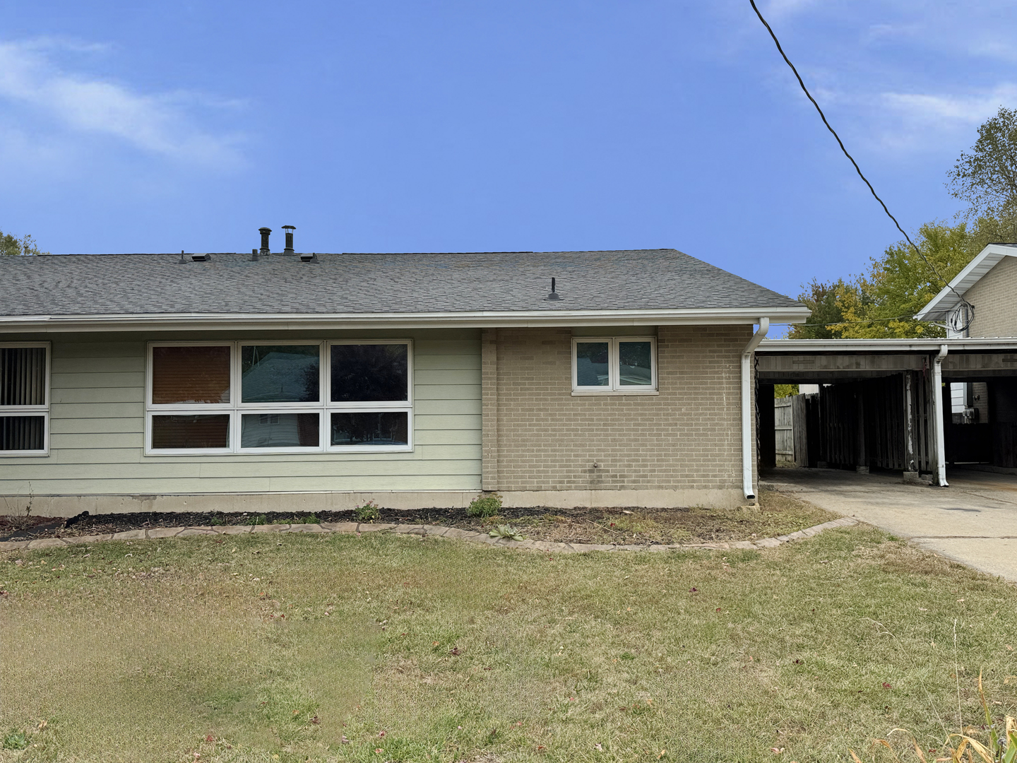 1612 Golfview Road Rantoul, IL 61866 - Photo 2 of 46 a house view with a garden space