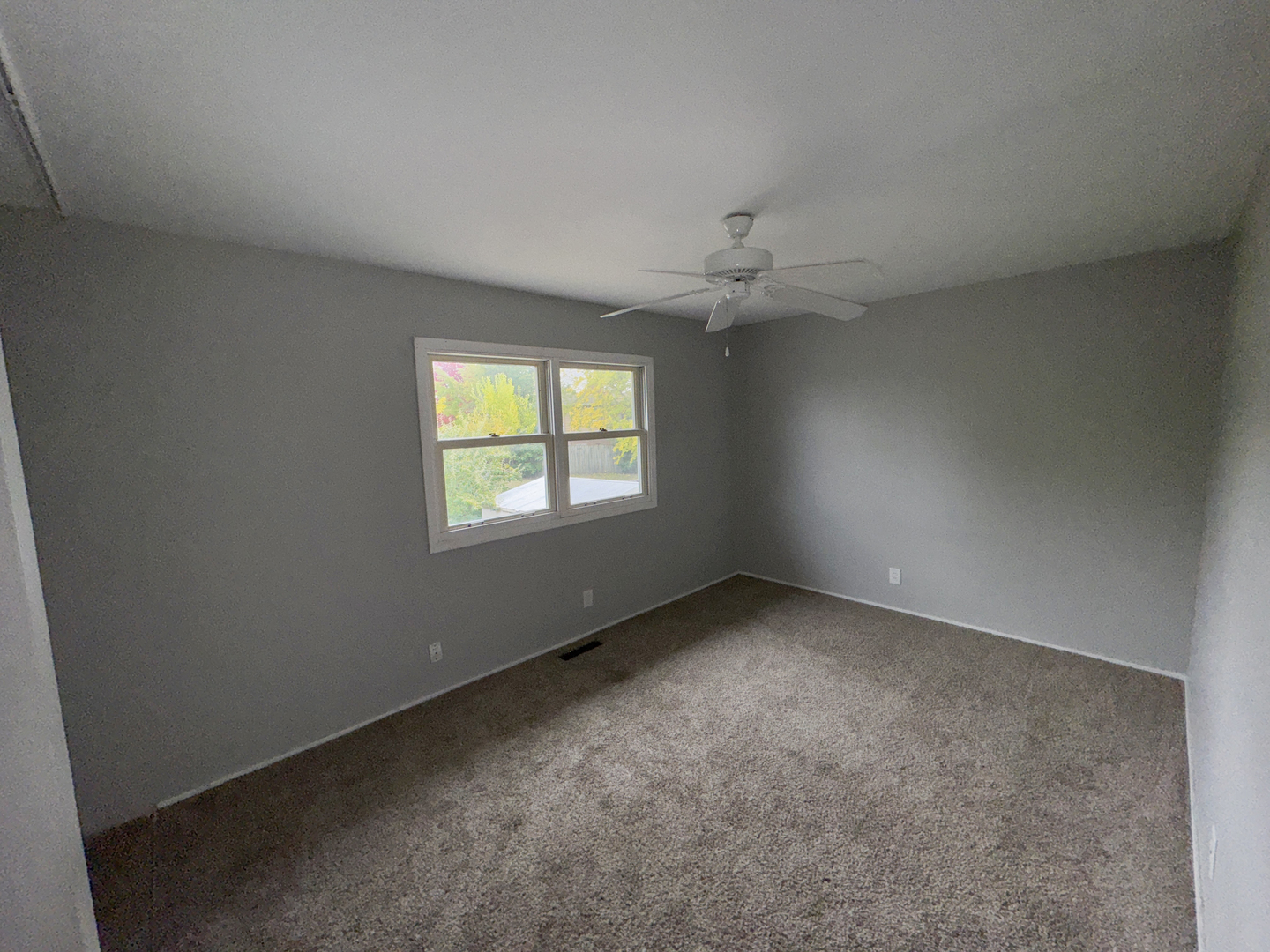 1612 Golfview Road Rantoul, IL 61866 - Photo 28 of 46 an empty room with a empty space and windows