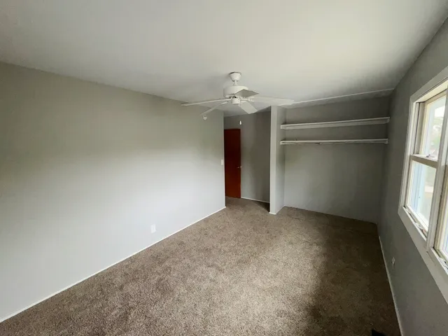 a view of an empty room with a window