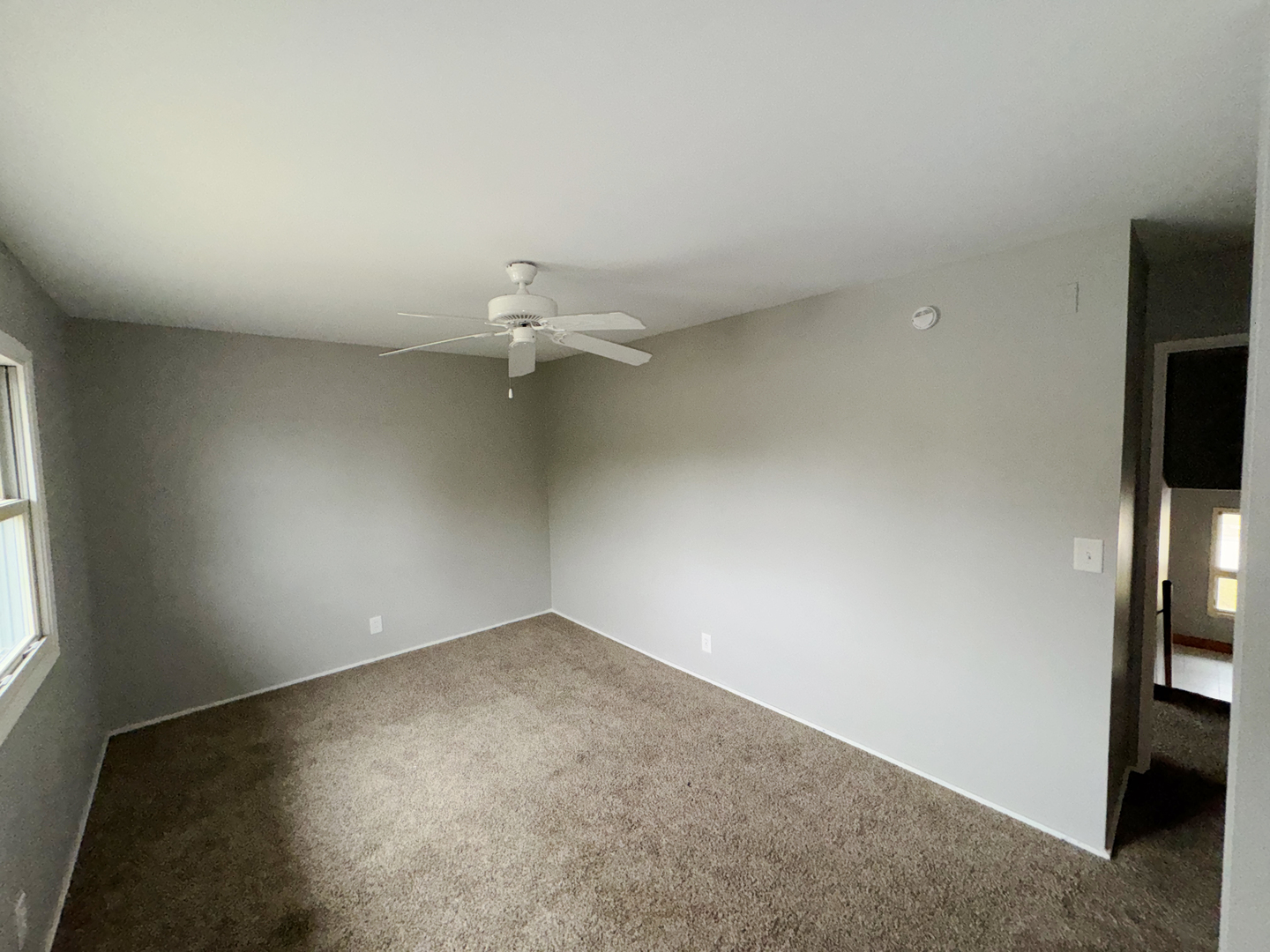 1612 Golfview Road Rantoul, IL 61866 - Photo 31 of 46 an empty room with a empty space and a window