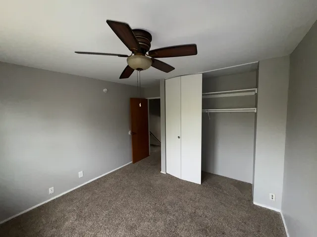 a white toilet sitting next to a bathroom sink