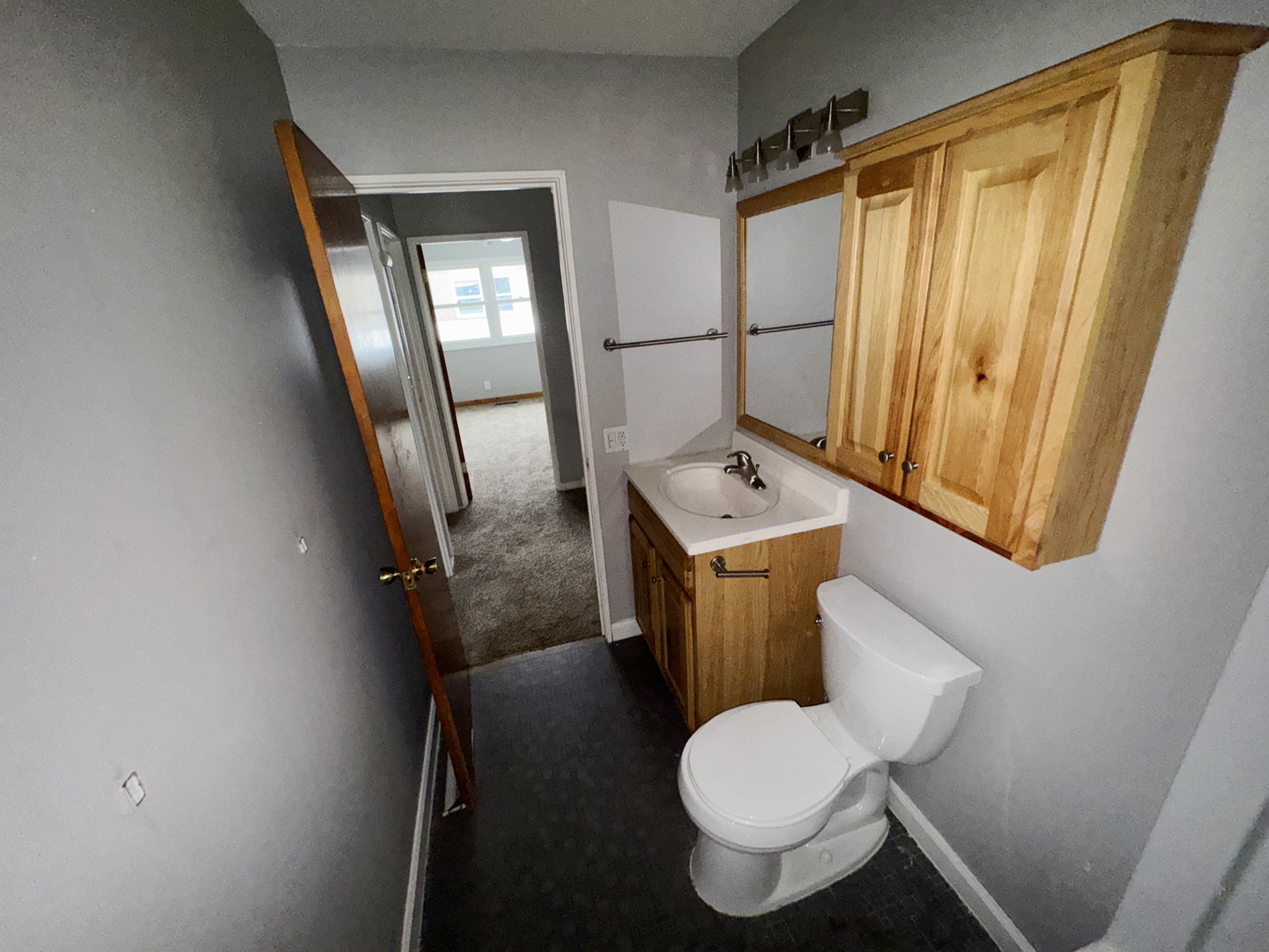 1612 Golfview Road Rantoul, IL 61866 - Photo 36 of 46 a white toilet sitting next to a window