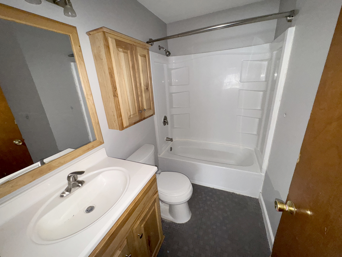 1612 Golfview Road Rantoul, IL 61866 - Photo 38 of 46 a bathroom with a sink a toilet and shower