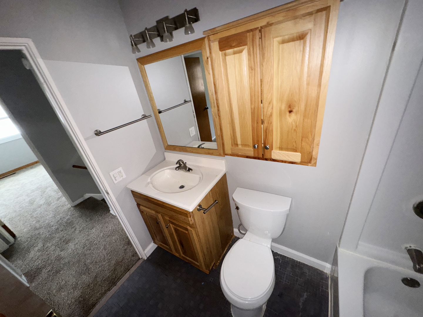 1612 Golfview Road Rantoul, IL 61866 - Photo 39 of 46 a white toilet sitting next to a bathroom sink