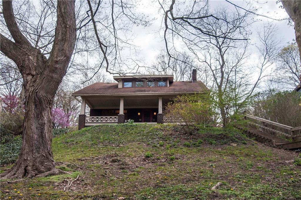 235 Woodside Road Forest Hills, PA 15221 - Photo 2 of 22 The Front of the home is private with beautiful trees and native vegetation.