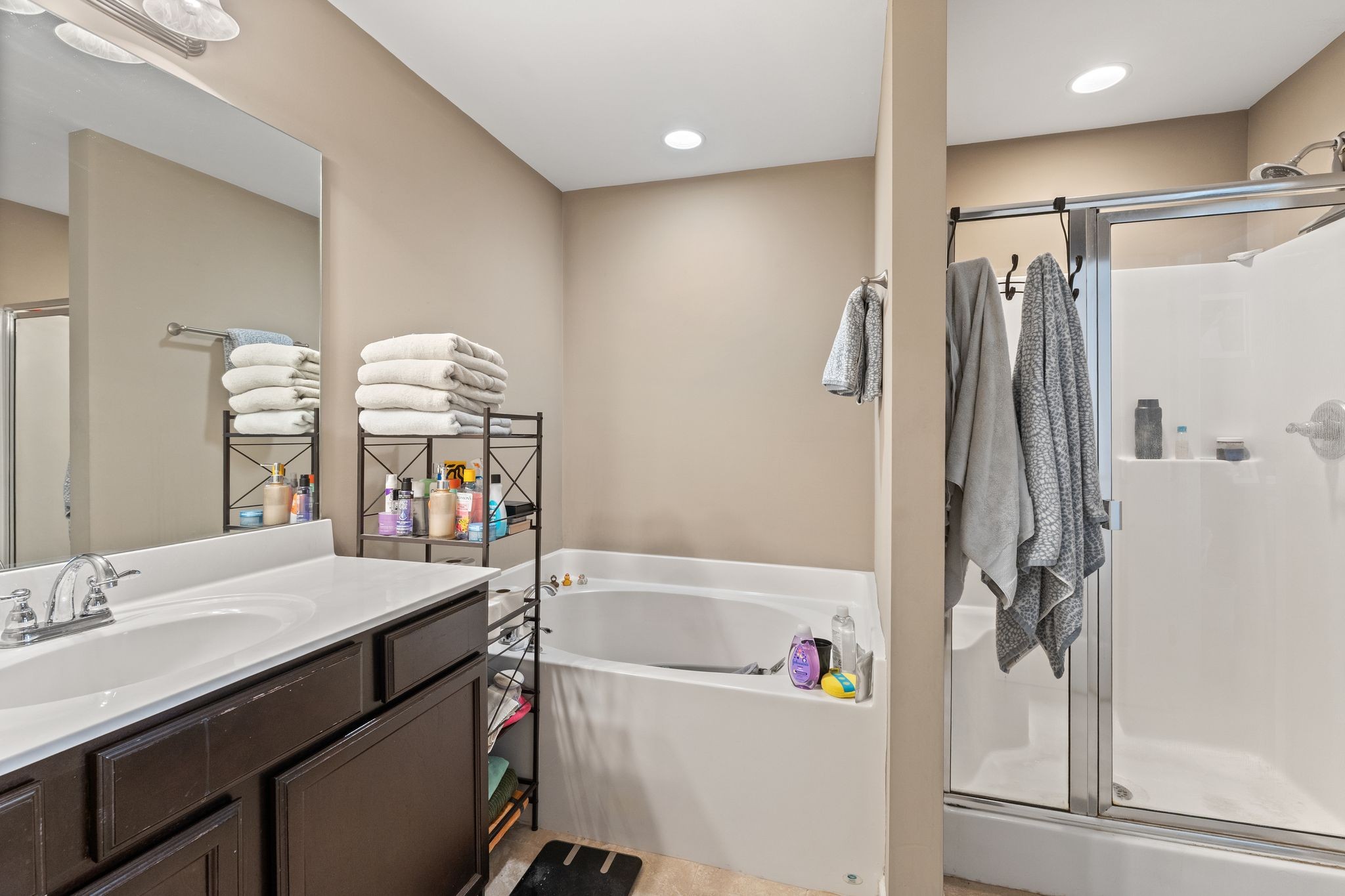 4020 Commons Drive Spring Hill, TN 37174 - Photo 20 of 37 a bathroom with a tub sink and mirror