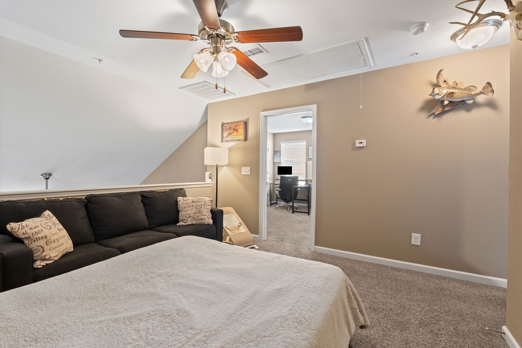 4020 Commons Drive Spring Hill, TN 37174 - Photo 24 of 37 a bedroom with a bed and a chandelier