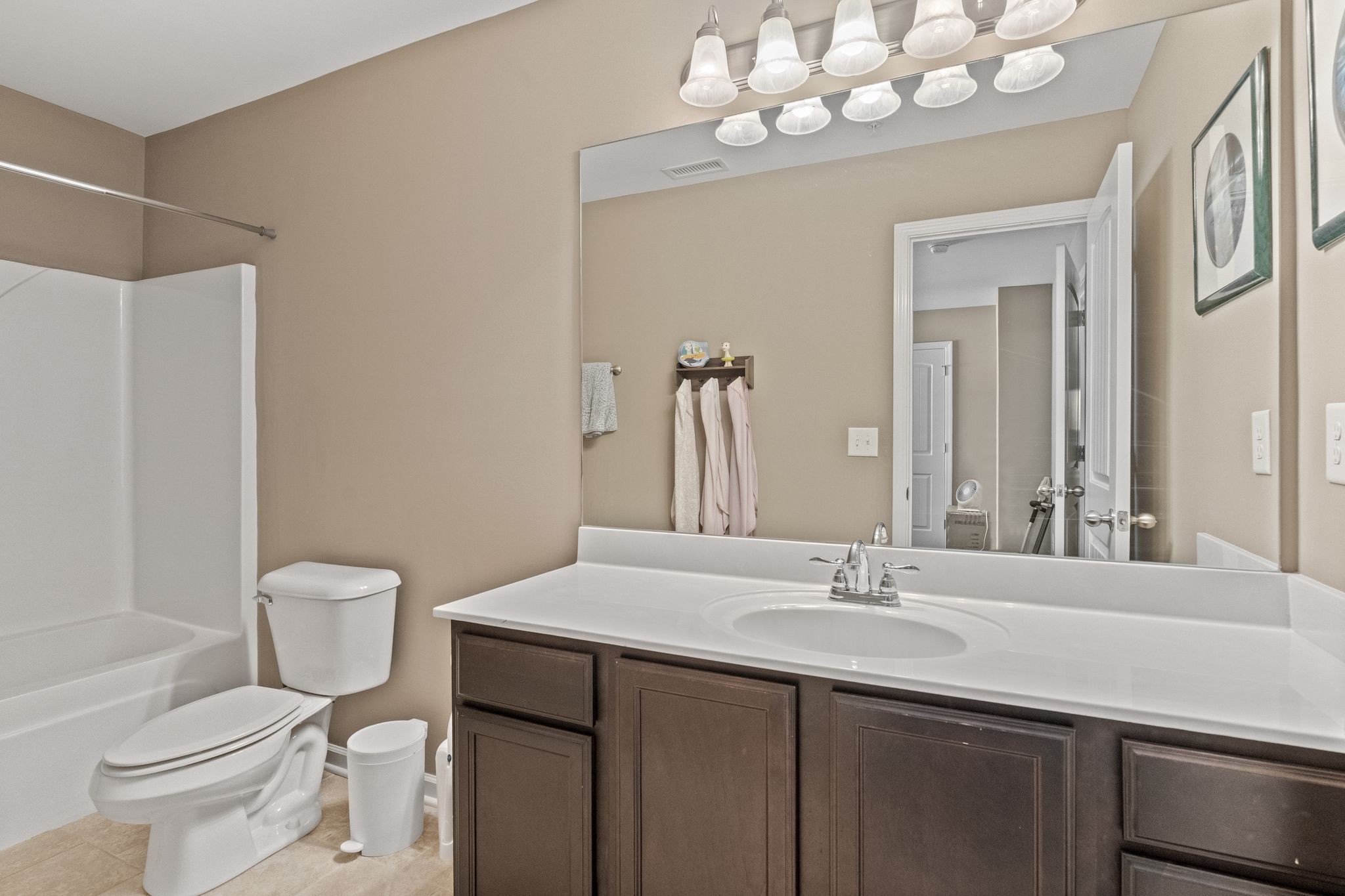 4020 Commons Drive Spring Hill, TN 37174 - Photo 27 of 37 a bathroom with a sink vanity mirror and toilet