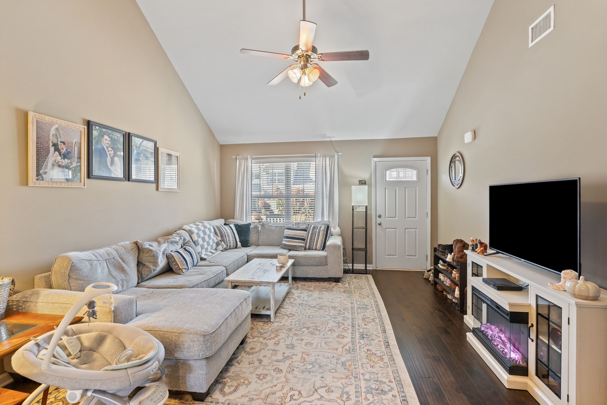 4020 Commons Drive Spring Hill, TN 37174 - Photo 6 of 37 a living room with furniture and a flat screen tv