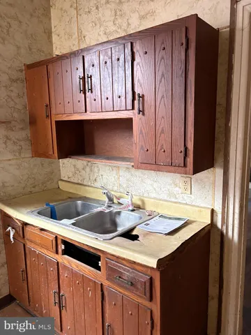 a kitchen with a sink and cabinets