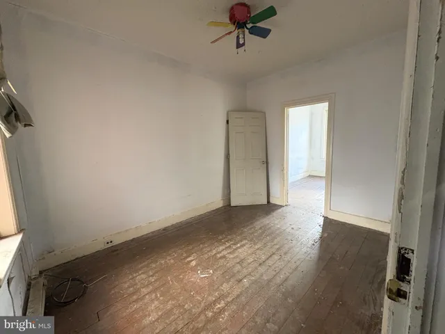 a view of an empty room and a window