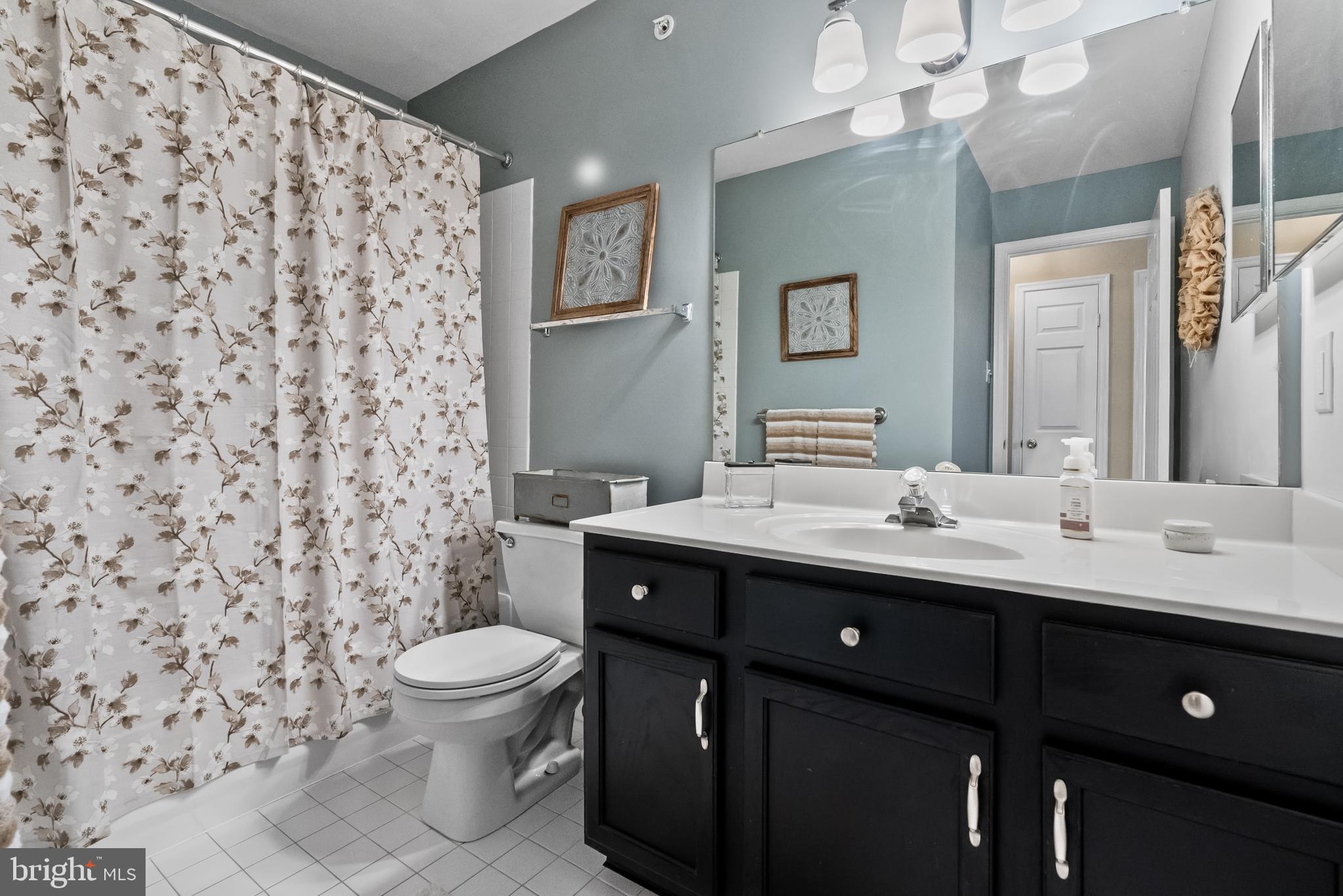 5 Chadwick Circle Eagleville, PA 19403 - Photo 18 of 32 a bathroom with a double vanity sink mirror and toilet