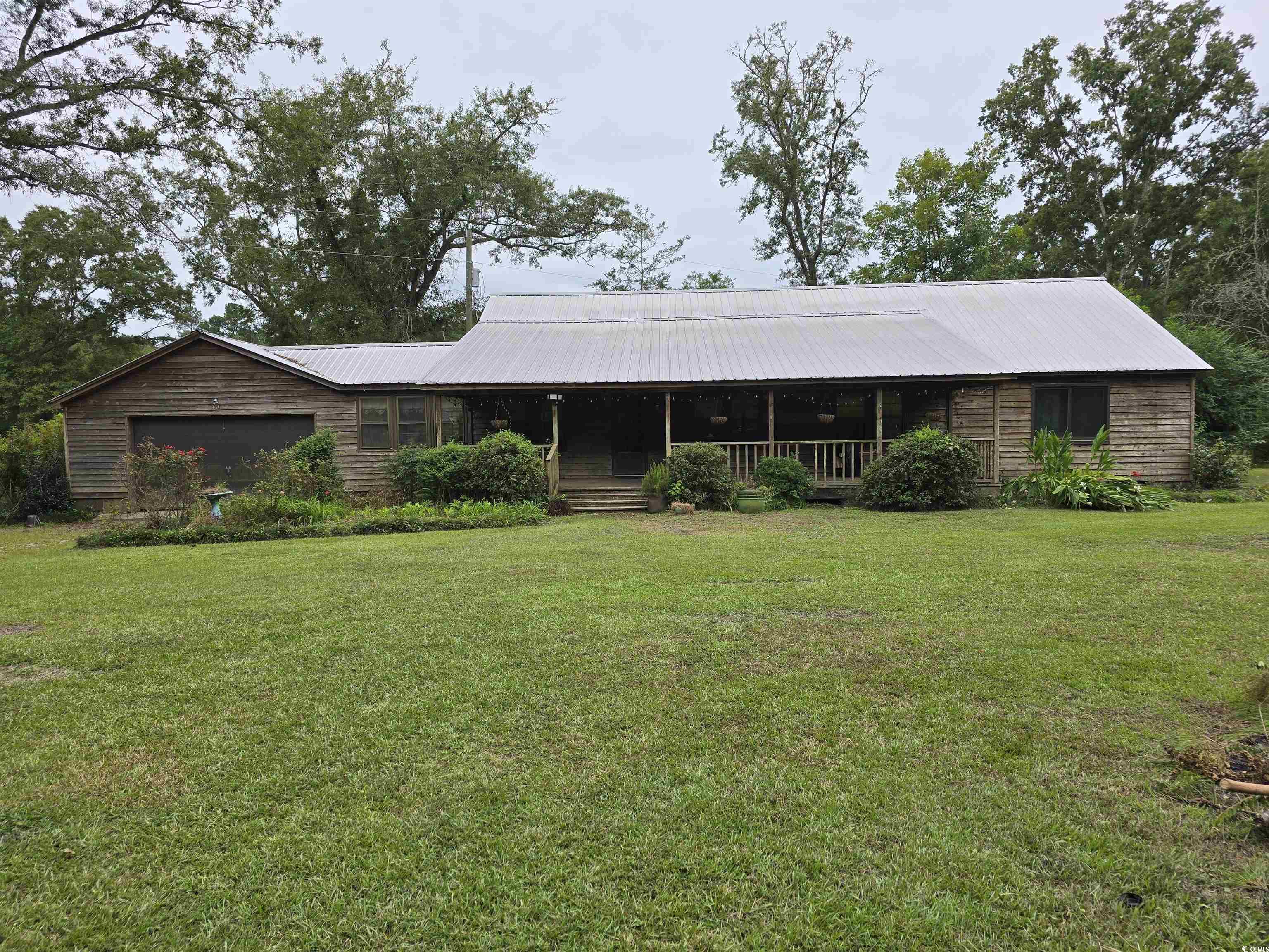 73 Porter Road Georgetown, SC 29440 - Photo 1 of 24 Single story home with a front lawn and a porch